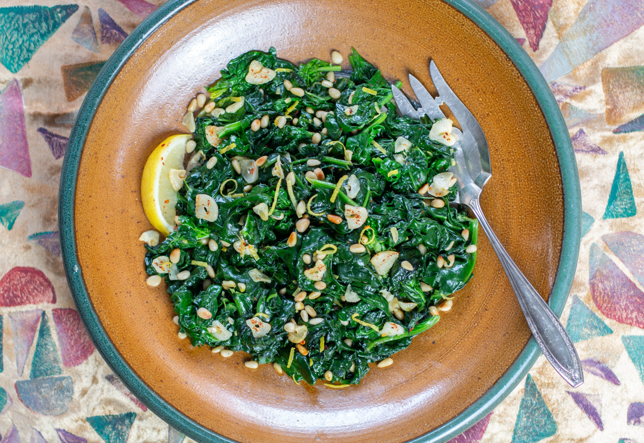 The finished sautéed spinach with lemon, garlic & pine nuts ready to serve