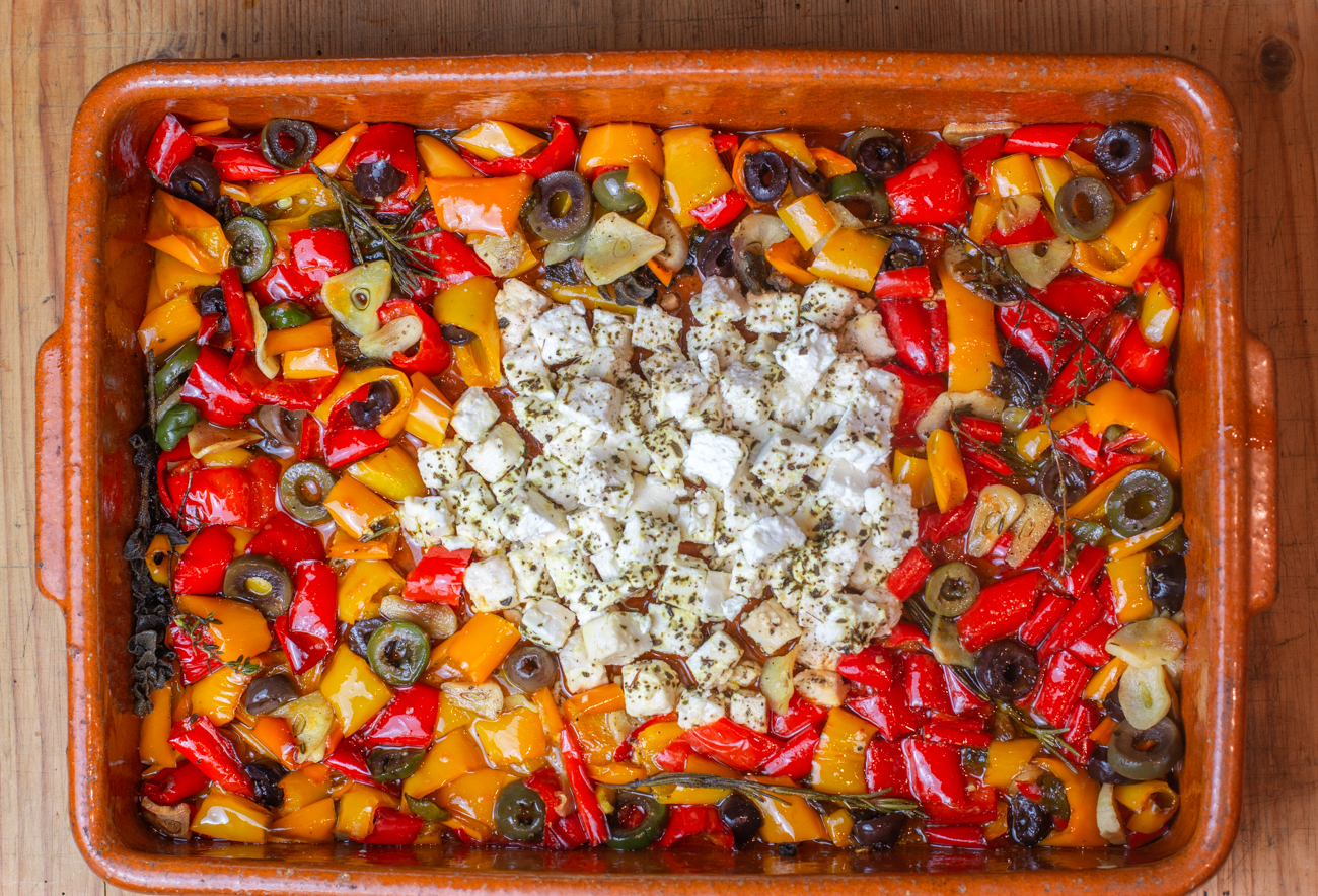 Out of the oven: Mediterranean Slow-Baked Appetizer with Feta, Colorful Peppers, Olives & Garlic