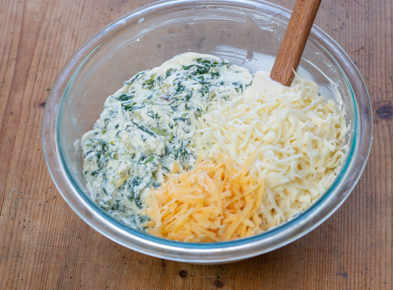 Stir in grated Monterey Jack Cheese and Aged Gouda 