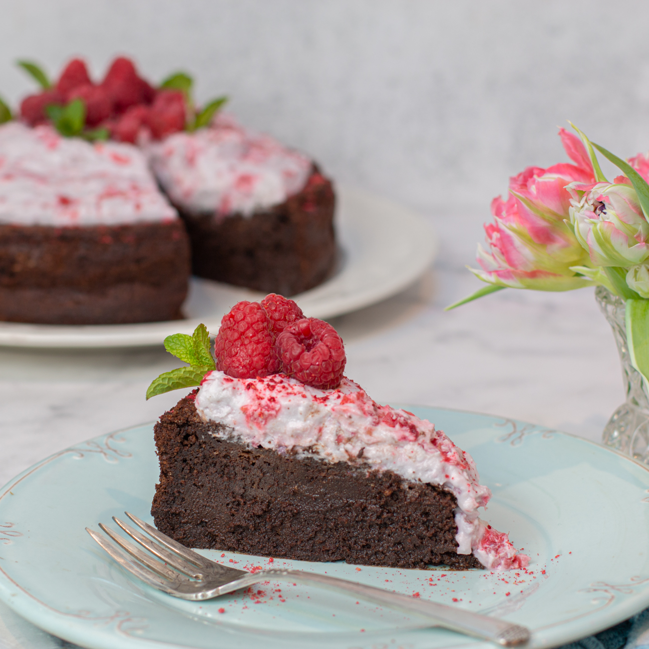 Flourless Chocolate Mousse Cake with Crushed Raspberry Coconut Whipped Cream