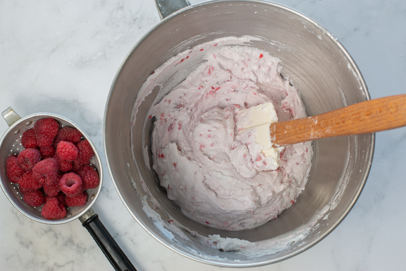 Add the fresh raspberries until the have broken up and are smashed