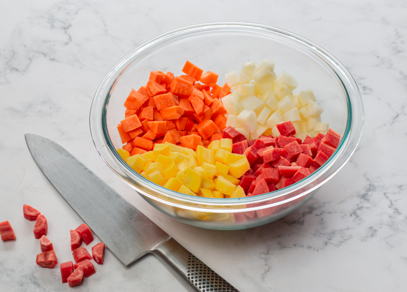 Peel and cut carrots into 1/2" cubes 