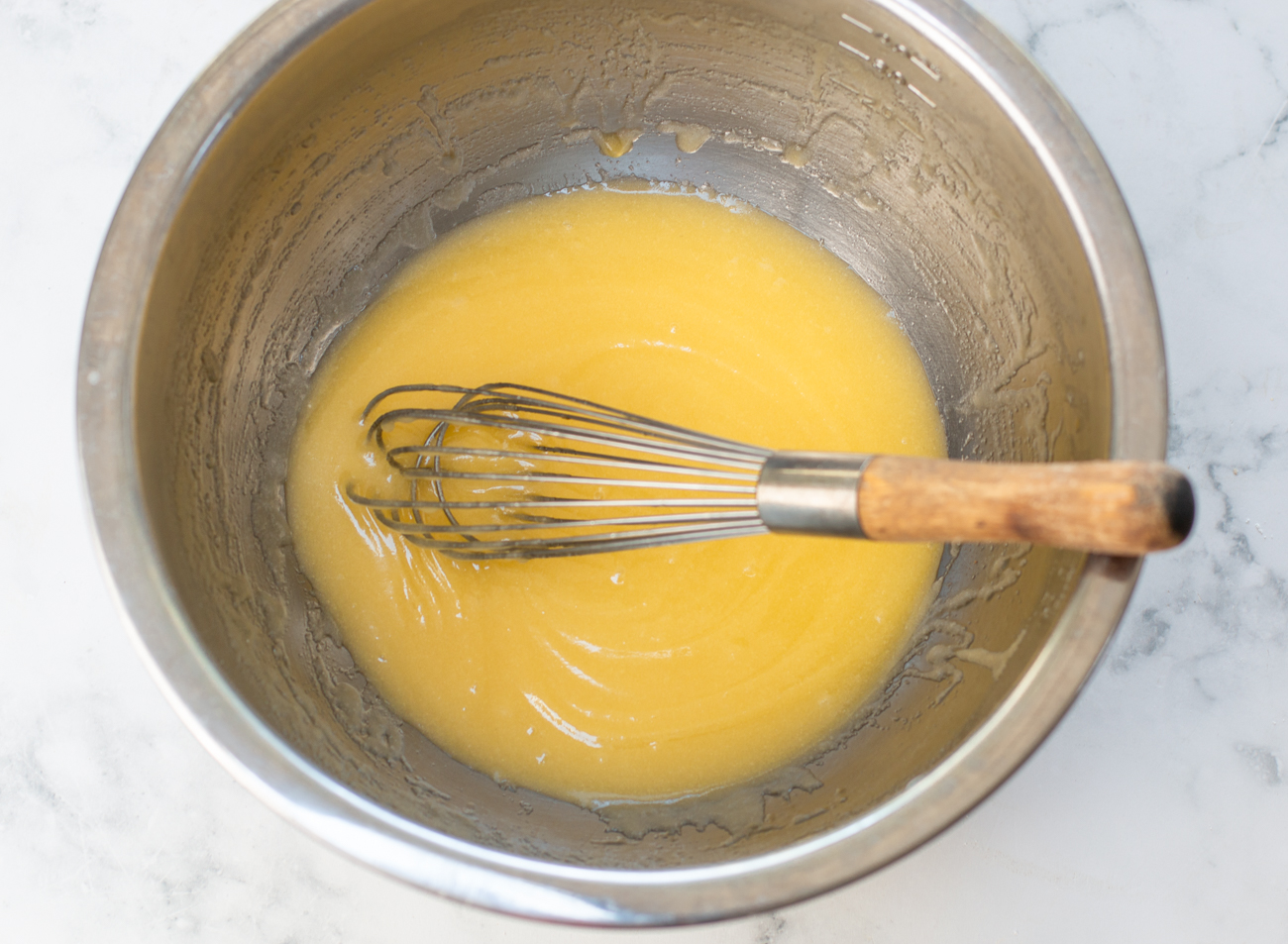 Whisk melted butter with sugar until light and creamy