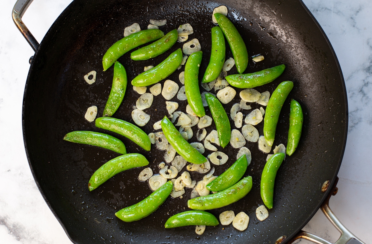 Saute Sugar Snap Peas, add thinly sliced Garlic