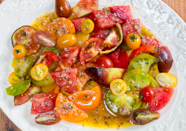Marinate a colorful array of Heirloom Tomatoes in my Shallot-Thyme Vinaigrette