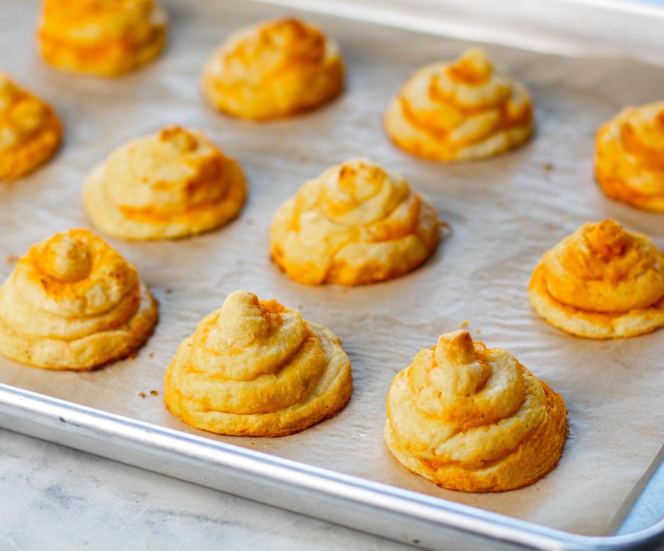 Duchess Potatoes with Butternut Squash Swirl out of the oven