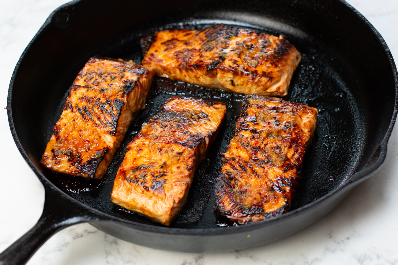 Cooking the salmon fillets in a cast iron skillet