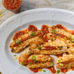 Spiced Herbal Grilled Red Fish with Roasted Red Pepper Coulis close-up
