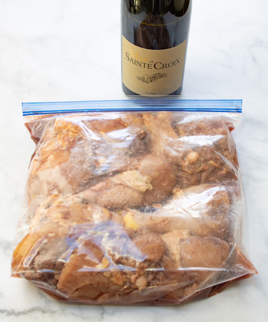 Chicken pieces marinating in red wine for Coq au Vin