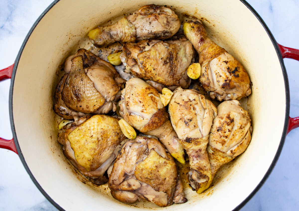 Brown the seasoned chicken in the Dutch oven