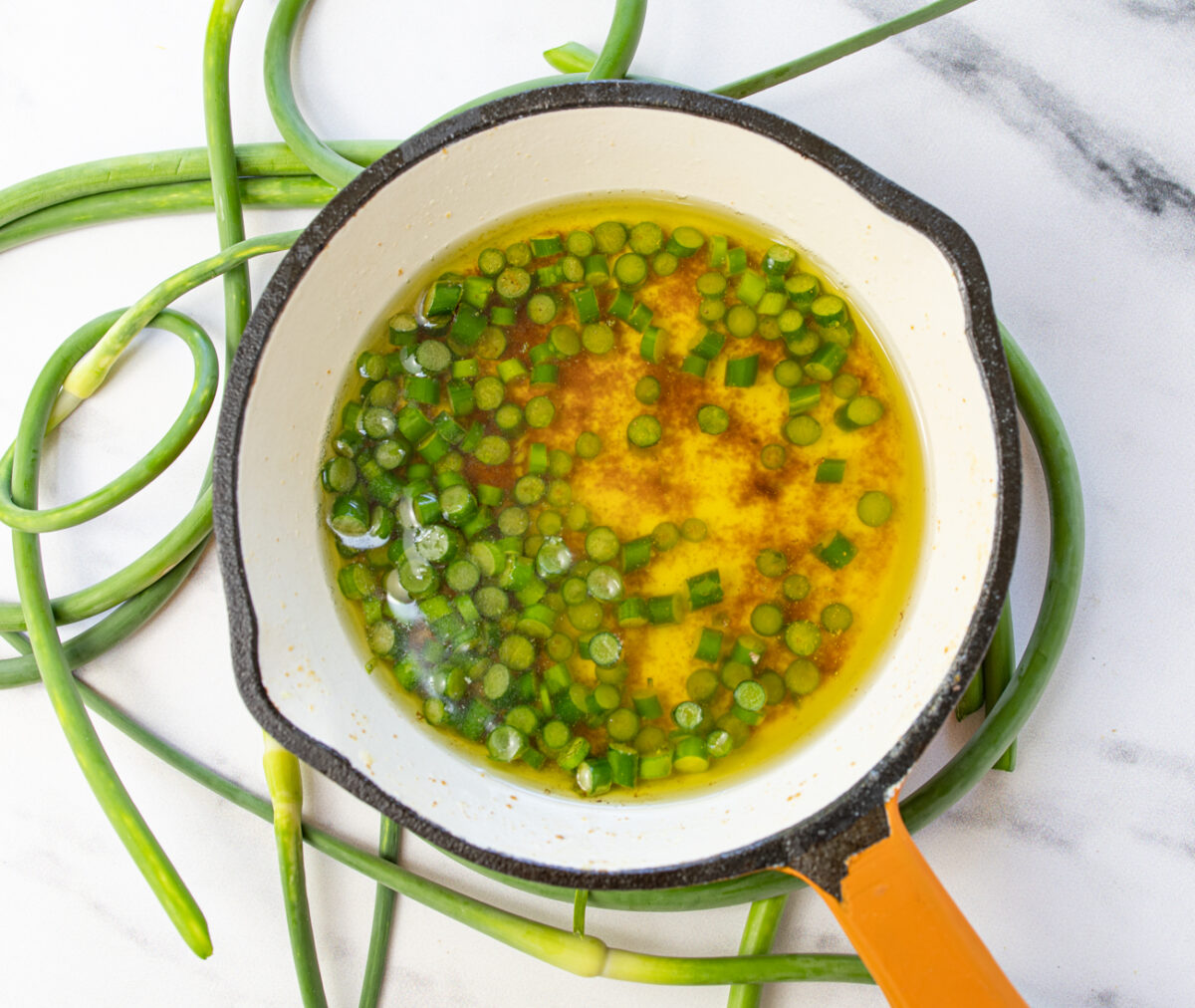 Browned Butter with Garlic Scapes (Over Local Mixed Veggies)