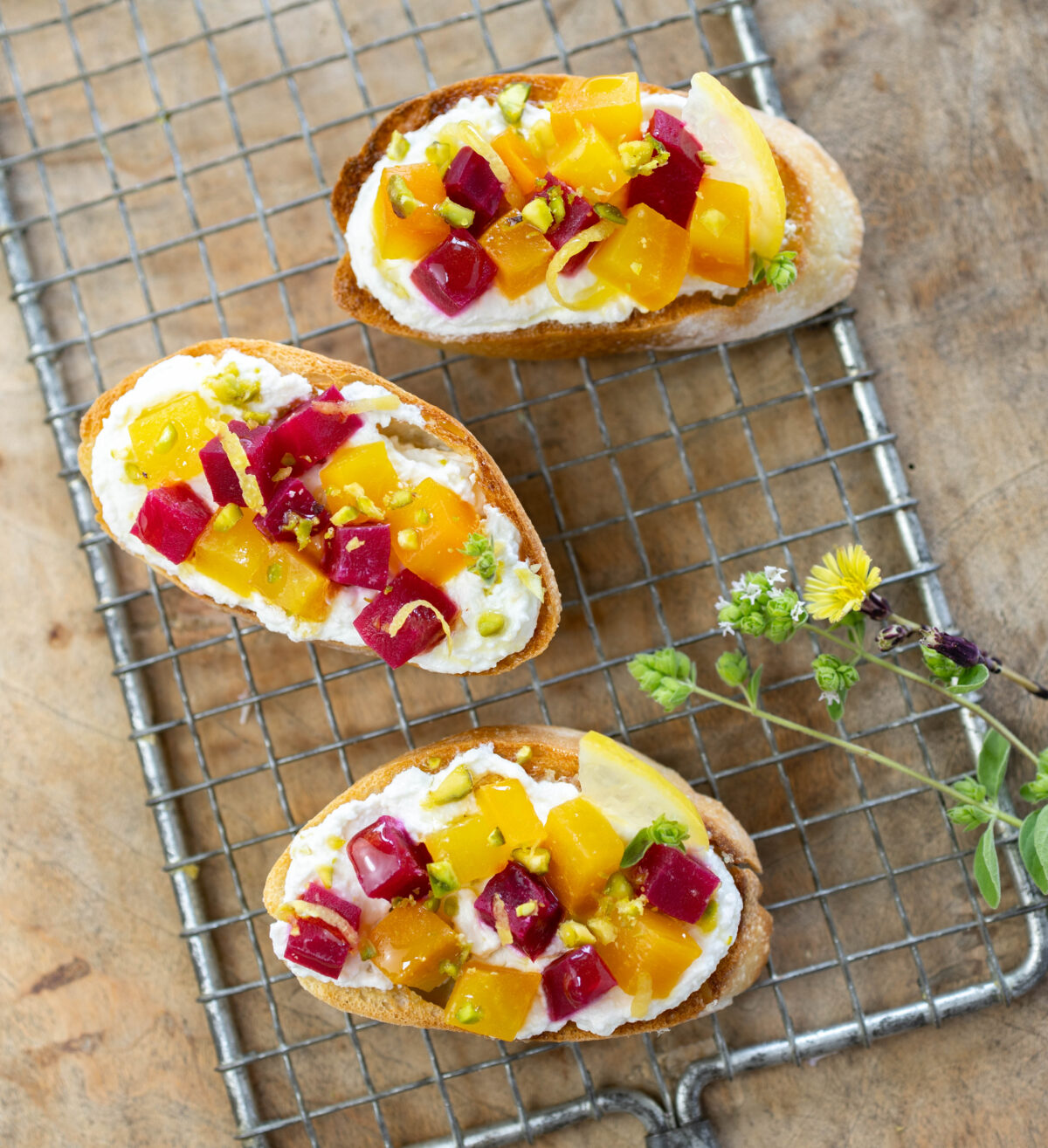 Roasted Golden and Ruby Beet Bruschetta over Whipped Lemon Feta with Pistachios