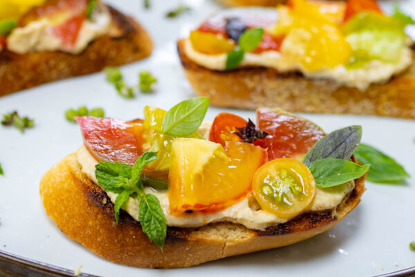 Quick & Delicious Heirloom Tomato Bruschetta with Hummus, Basil & Mint